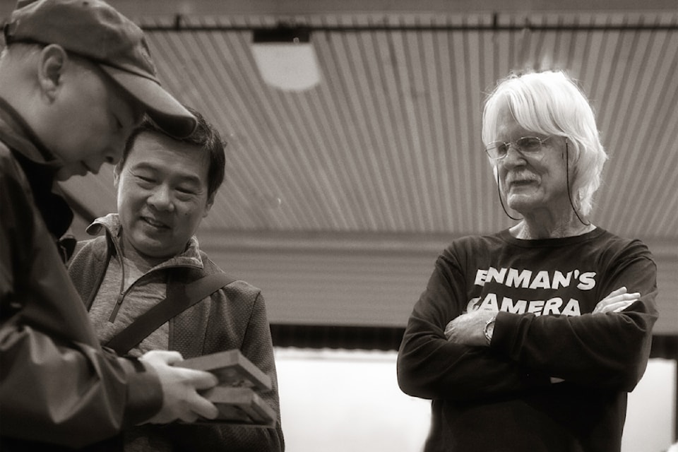 John Enman (far right) exploring the last camera sale of the year in  Nov. in Vancouver.  