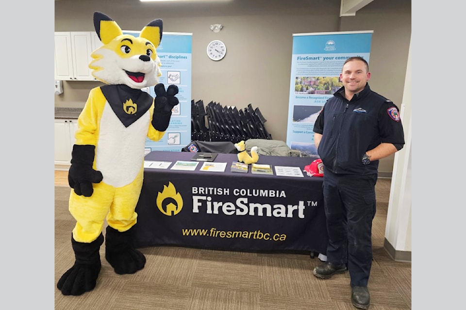 Ember the FireSmart mascot and FireSmart coordinator Chance Breckenridge offered information to residents of Clearwater at the DOC Open House held on January 22 at the DLCC.