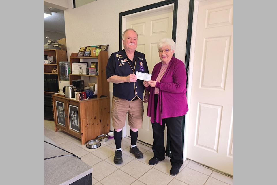 (From L-R): Barriere Lions Club member, Antoon Houben presented a cheque for $1,280 Barriere and area literacy outreach coordinator for Yellowhead Community Services, Jill Hayward on Tues. Nov. 12. The funds were raised from the annual Lions Club book sale.