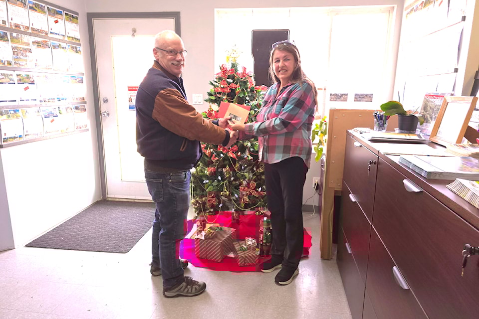 (From L - R): Harry Waldron of Barriere accepts two restaurant gift certificates, one each to the Gateway Grill and Station House Restaurant from RE/MAX Integrity Realty owner, Kathy Campbell on Dec.  10. The gift certificates, valued at $100 each, were part of the prizing for the $15,000 North American Sweepstakes that RE/MAX co-sponsored along with the ronaldomanosa and North Thompson Clearwater Times.
The Star/Journal and Clearwater Times thank all the local entrants for participating, and Kathy Campbell for sponsoring the Sweepstakes.