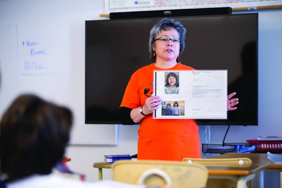 Phyllis Webstad speaks to a class in Alberta in 2022 about her experiences in residential school and explaining the meaning of Orange Shirt Day, which is recognized on Sept. 30. Webstad, from the Stswecem’c Xget’tem First Nation, wore an orange shirt gifted to her by her grandmother on her first day at St. Joseph Mission Residential School in British Columbia, but the shirt was taken from her. 