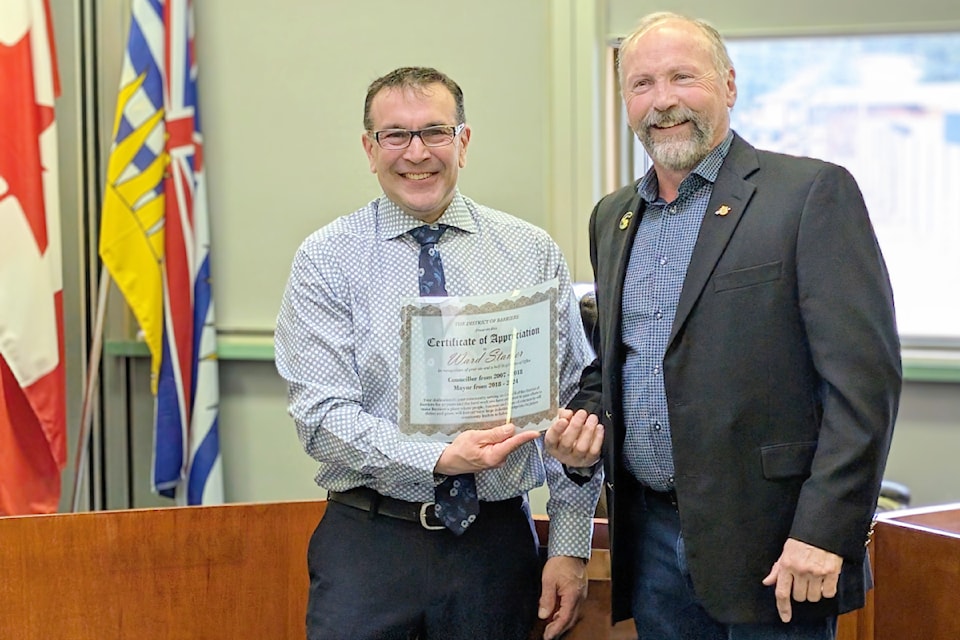 (From L - R): Newly elected mayor of Barriere Rob Kerslake presenting former mayor of Barriere and current Kamloops-North Thompson MLA Ward Stamer with a commemorative plaque in recognition of his years of service to the community on March 24.
