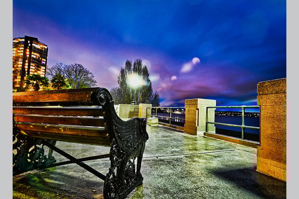 Rainy weather at English Bay in Vancouver contributed to this photo of the empty walkway and bench, the result of a typical west coast downpour.