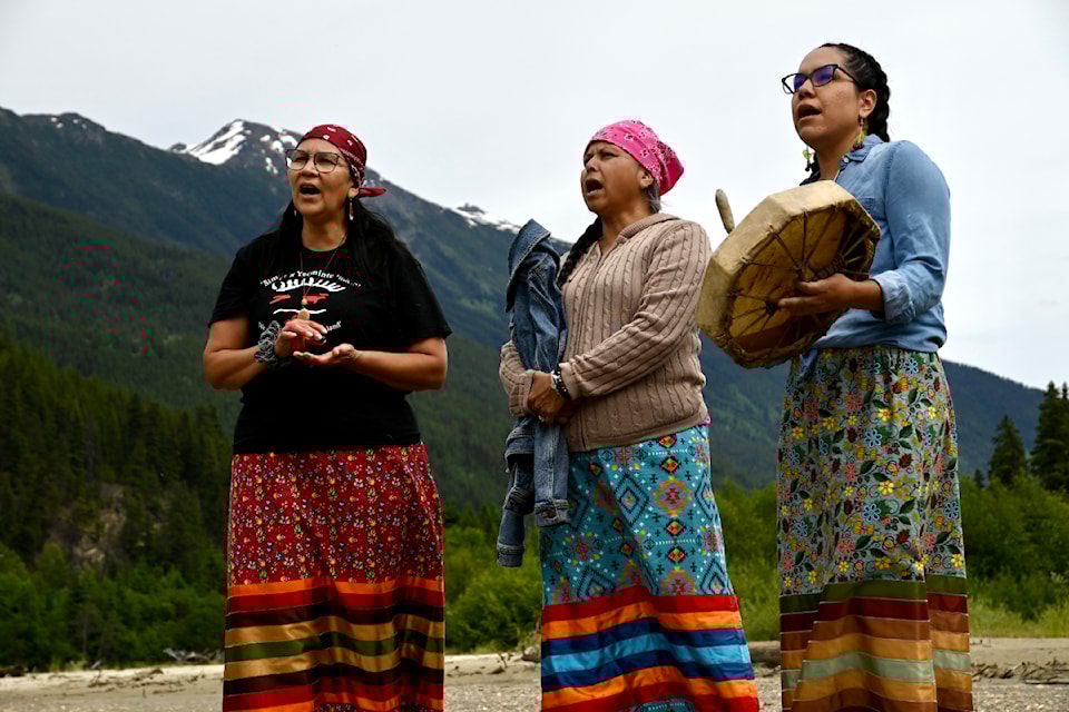 Simpcw First Nation drummers singing an honour song during the R.au.Sh helicopter tour event in the Robson Valley on June 26, 2024.