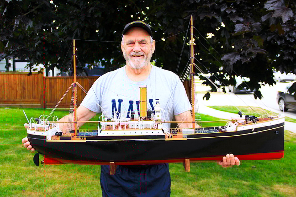 Yvon Lehoux holds a model of the SS Komagata Maru. A neighbour commissioned him to build the ship.