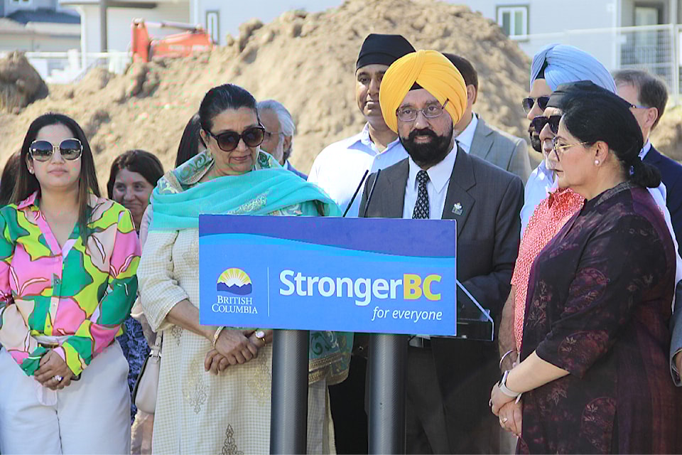Satbir Cheema, president and CEO of Progressive Intercultural Community Services Society, or PICS, speaks during the ground-breaking ceremony for a new long-term care home in Cloverdale. Cheema is flanked by members of the PICS board of directors.