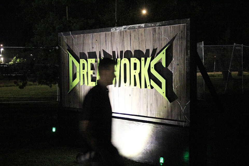 A man walks past the entrance sign for Dreadworks Haunted House. The "immersive scare experience" opens on the Cloverdale Fairgrounds for five weeks beginning Sept. 27.