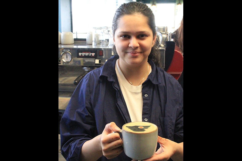 Fateen Ehtesham holds a colour-coffee printed latte at Elena's Cafe in Cloverdale. Fateen says her shop is the first in North America to offer colour printing on coffees.