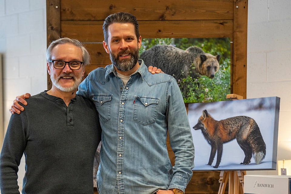 John Banovich (left) and Derek Mason pause for a picture during Banovich's recent book launch party, held at Mason's Cloverdale Home Furnishings.