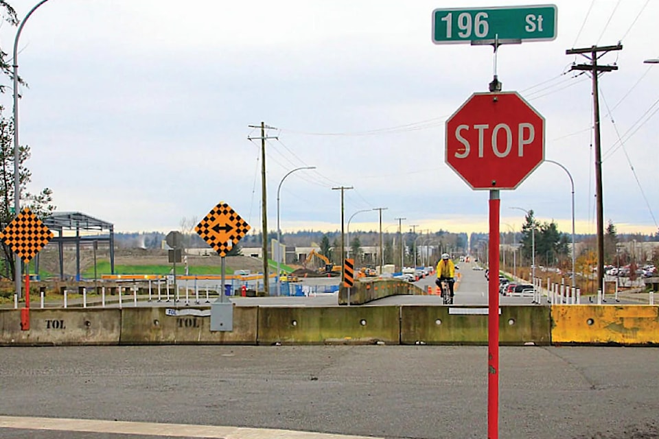 A cyclist navigates the barricades that lie across 24th Avenue in Campbell Heights Jan. 7. The road connection between Surrey and 91ԭ Township may not open immediately, if Township officials have their way.