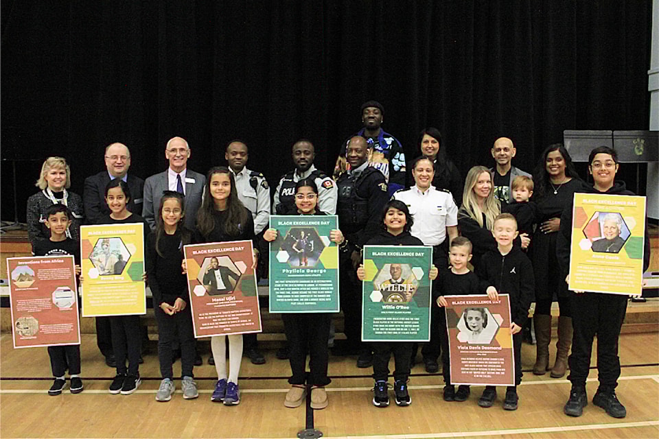 Speakers, organizers, dignitaries and students stand for a picture after Black Excellence Day celebrations at Cloverdale Traditional School jan. 15.
