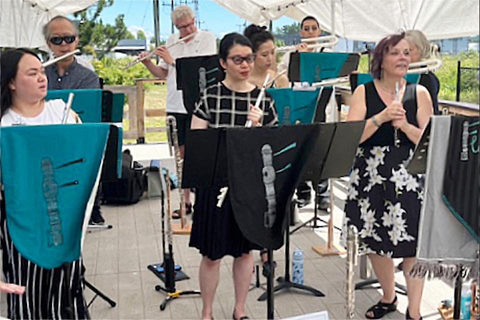 The band Fluterriffic entertains visitors at Cloverdale Station July 13 as the Fraser Valley Heritage Railway Society's summer music fest is in full swing.