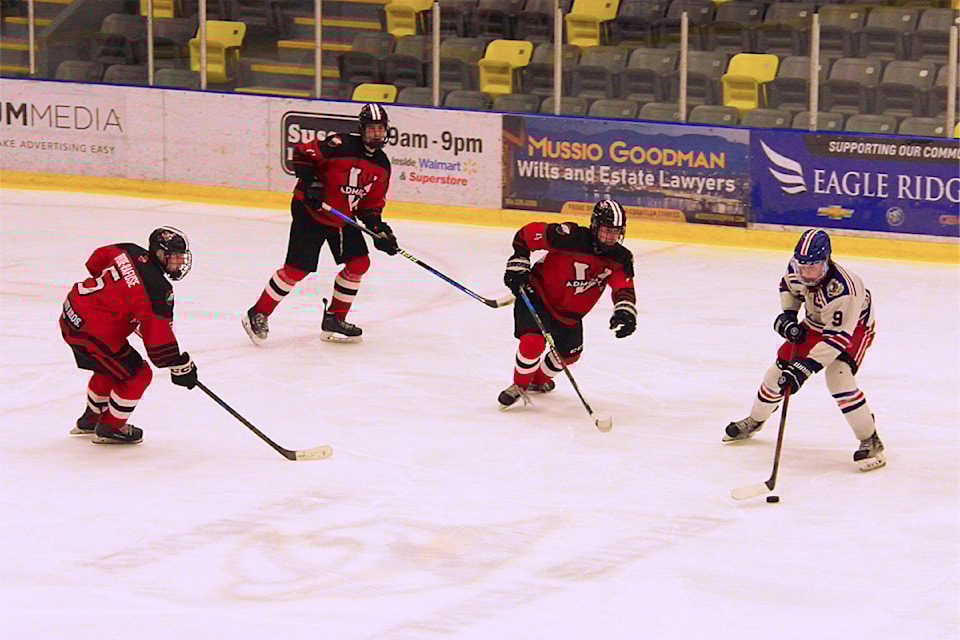 Matteo David Galasso runs out of room to maneuver after coming up against a wall of Victoria Admiral players March 19.