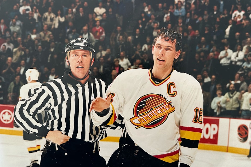 Cloverdale's Baron Parker, former NHL linesman, is seen on the ice with Vancouver Canucks captain Trevor Linden. Parker passed away in February.