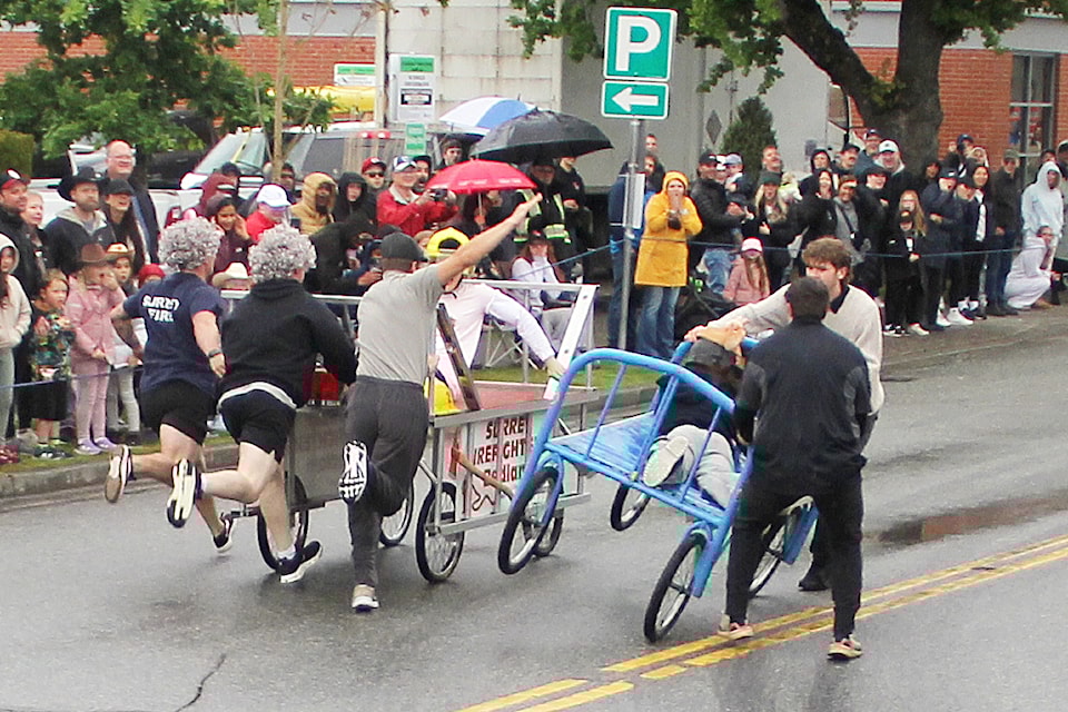 Surrey Firefighters pull past Turkey's Party Makers Racing Team in the men's final at the 2025 Cloverdale Bed Races, narrowly avoiding a messy collision in the process.