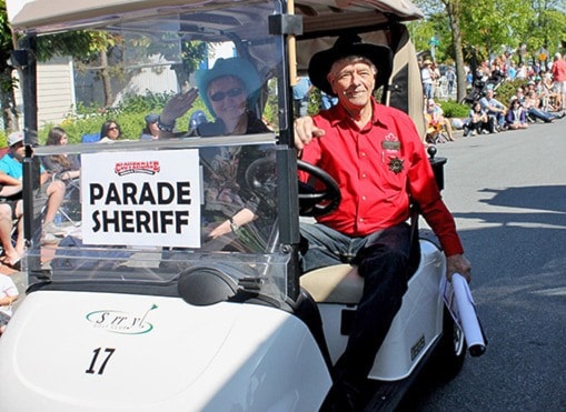 68514cloverdalewBill-Reid-riding-a-golf-cart-in-a-parade