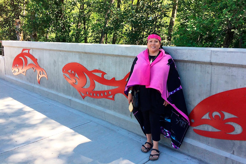 17277348_web1_Phyllis-Atkins-with-the-salmon-in-her-public-artwork