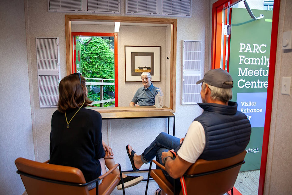 Jack Hollands, 89, tests out a new ‘family meetup centre’ created by PARC Retirement Living so residents can safely see their family during COVID-19. (PARC Retirement Living photo)