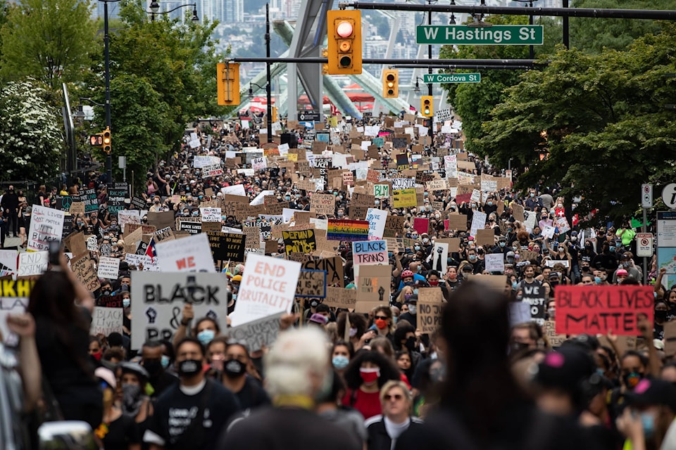 Thousands of people march to mark Juneteenth, in Vancouver, B.C., Friday, June 19, 2020. THE CANADIAN PRESS/Darryl Dyck