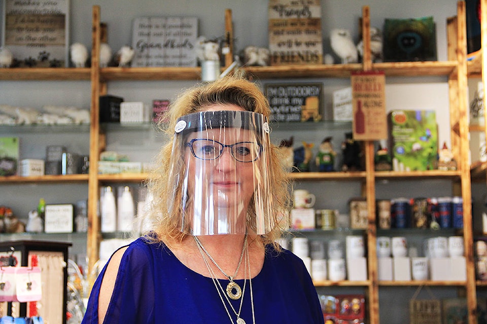 Tricia Ellingsen stands in her store, Tricia’s Gems, in Cloverdale. Ellingsen wants to give away more than 200 face shields (pictured) to a needy organization. (Photo: Malin Jordan)