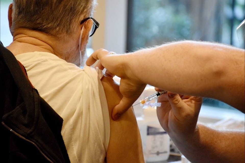 An Amica White Rock resident receives the COVID-19 vaccine during a Jan. 15, 2021 clinic. (Tracy Holmes photo)