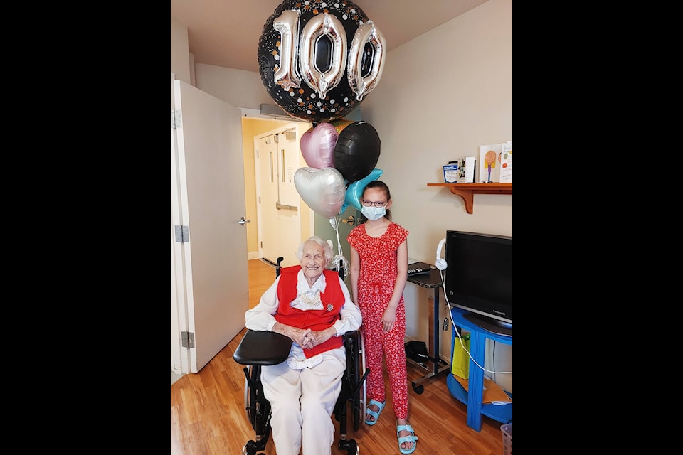 Long-time Cloverdale resident Peggy Hansen and her great-granddaughter, nine-year-old Charlotte, celebrate Peggy’s 100th birthday June 2 at Rosemary Heights Seniors Village. Peggy’s two remaining daughters, seven grandchildren, and 10 great-grandchildren helped the centenarian celebrate her unique milestone. (Photo: Submitted)