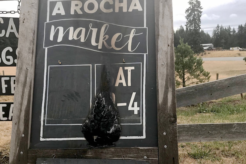 A sign advertising A Rocha’s market was set on fire early Saturday (July 17, 2021). (Contributed photo)