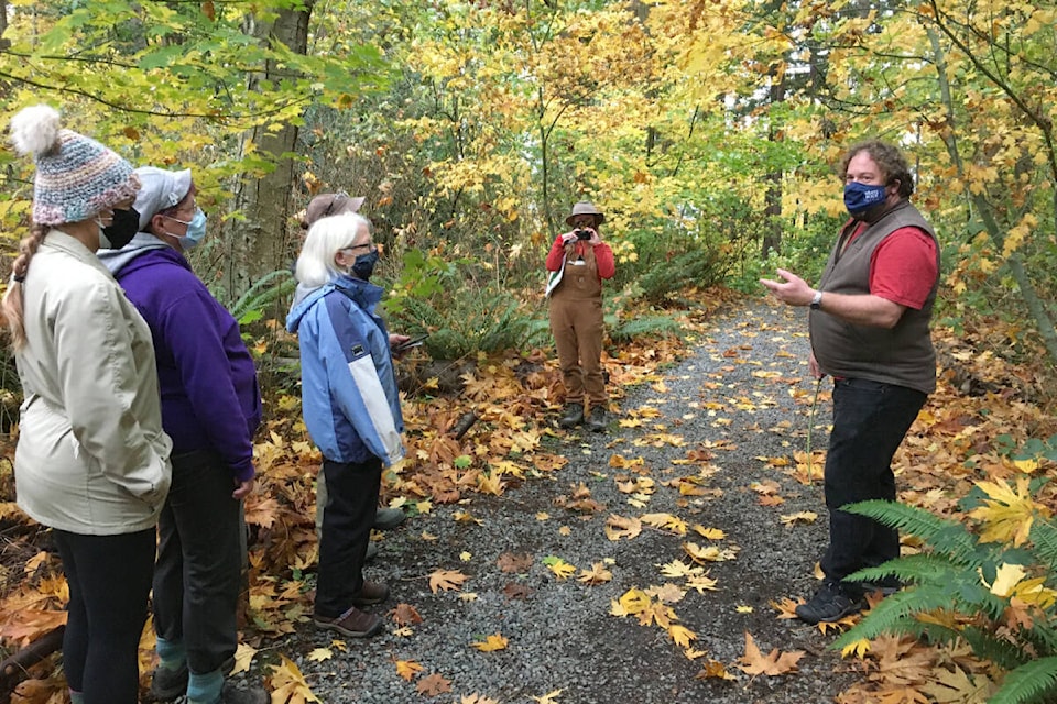 Led by the Lower Mainland Green Team and City of White Rock parks manager Egan Davis, about a dozen local residents took part in an interpretive nature walk at Ruth Johnson Park. The walk was followed by a few hours of invasive plant removal. (Lower Mainland Green Team photo)