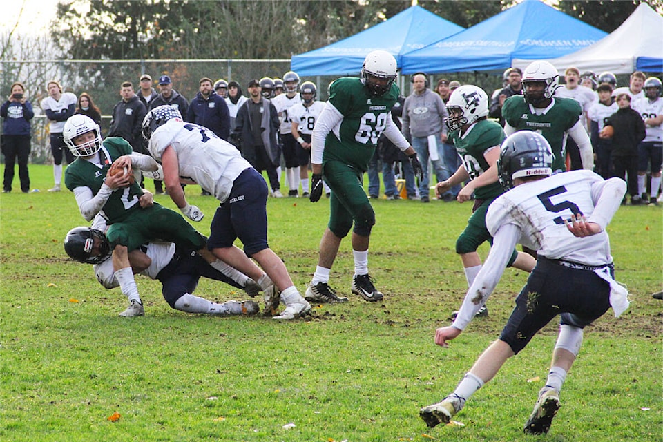 Quarterback McCord Leeson gets sacked by a G.W. Graham Grizzlie Nov.5. The Panthers lost to the Chilliwack team 18-12. (Photo: Malin Jordan)