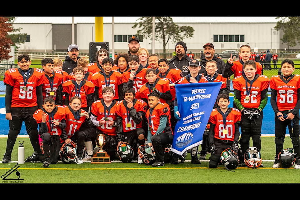The Cloverdale Peewee Bobcats hold their championship banner after winning the VMFL league title game over the White Rock Titans 22-6. (Photo submitted: Yeera Sami, Cloverdale Community Football Association)