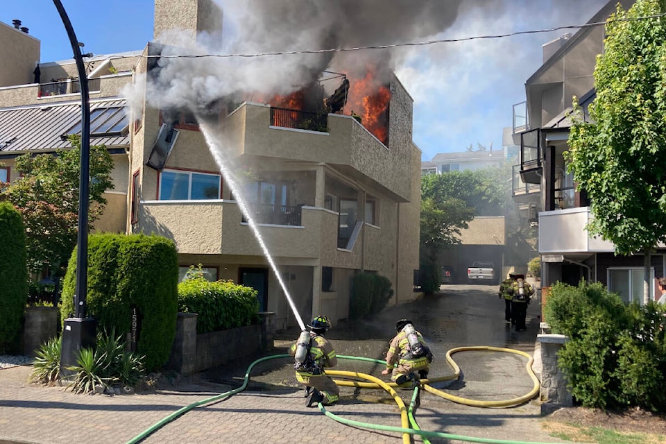White Rock firefighters battle a fire in a residential-commercial building on Marine Drive and Stayte Road Wednesday afternoon. (Photo courtesy White Rock Fire Rescue)