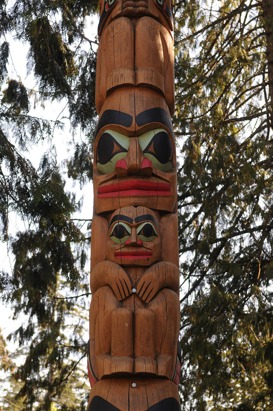 This totem pole was rededicated to the late Chief Richard Malloway outside the Cultus Lake Park Board office on Tuesday, Sept. 20, 2022. The third figure on the totem pole is a man holding a child representing Chief Richard Malloway as a family man. (Jenna Hauck/ Chilliwack Progress)