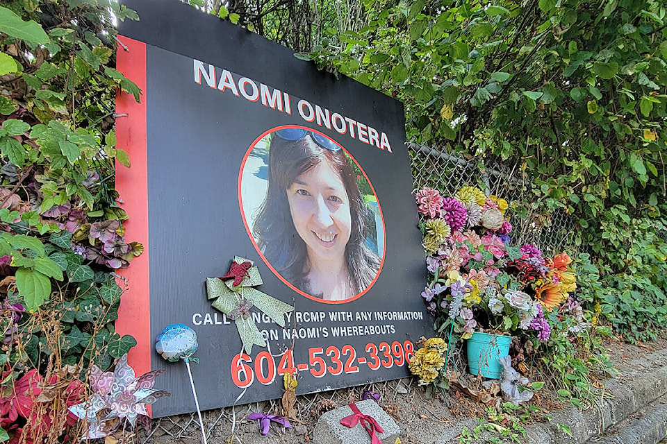 A memorial remains outside the home of Langley City homicide victim Naomi Onotera, who died in 2021. On Monday, Oct. 3, online ads to sell the house on 200th Street were posted. (Dan Ferguson/Langley Advance Times)