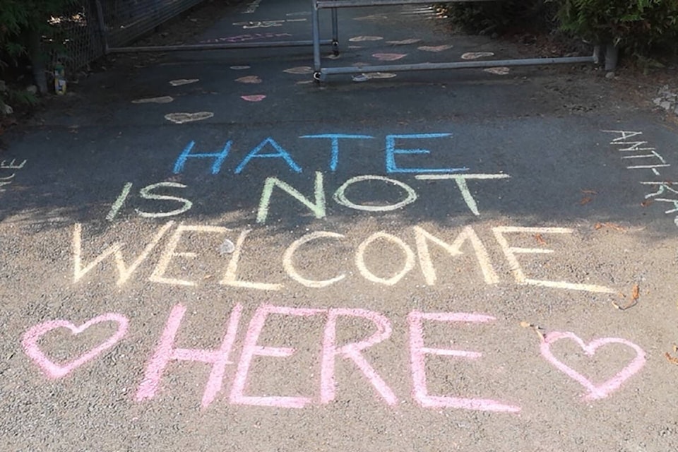 The walkway where a racial slur targeting Chinese-Canadians of a South Surrey neighbourhood has now been covered in kindness with messages supporting the group. (Contributed photo)