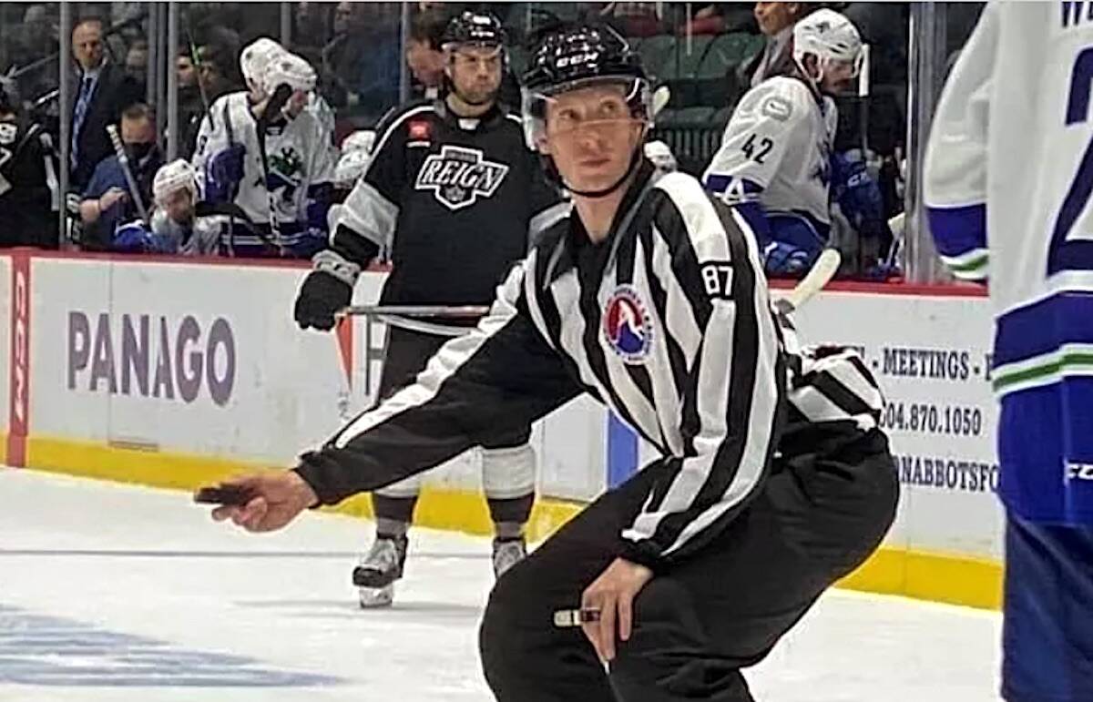Hockey linesman Mike McGowan drops a puck during an American Hockey League game between Abbotsford Canucks and Ontario Reign, in a photo posted to gofundme.com/f/smoothie-fundraiser.