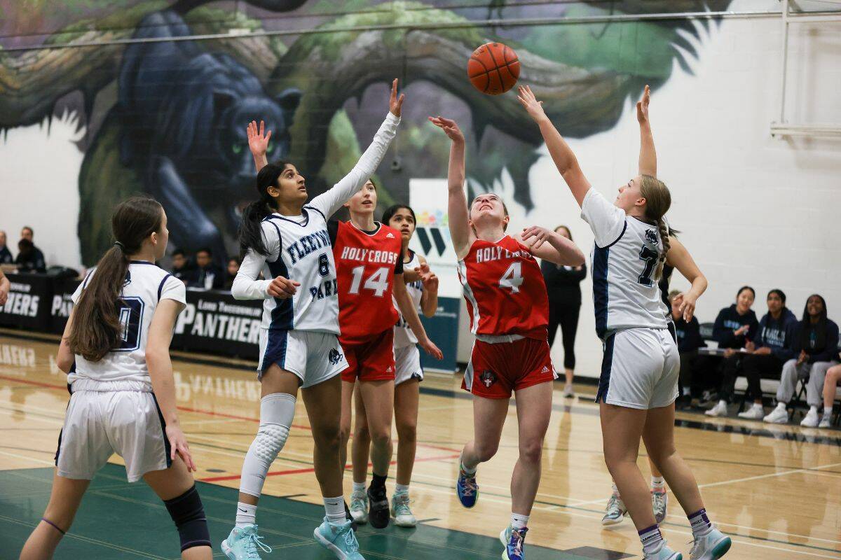 Action between Fleetwood Park Dragons and Holy Cross Crusaders during Saturdays Axe Division final game of the Surrey Fire Fighters Goodwill Senior Girls Basketball Classic tournament at Lord Tweedsmuir Secondary. (Photo: Anna Burns)
