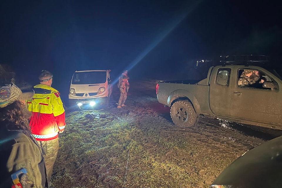 One of the vehicles in Rogers’ medical convoy in eastern Ukraine gets stuck in the mud on a patient transport run. On the edge of a minefield, the medics and their military accompaniment had to be extremely careful. As they were preparing to leave, Rogers looked down and saw a tripwire (middle of image). (Photo submitted: Will Rogers)