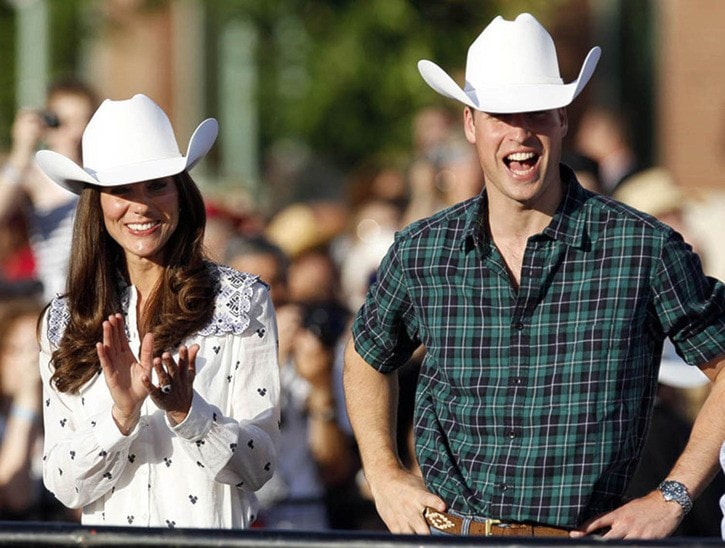 Britain's Prince William and his wife Catherine, Duchess of Cambridge watch bull riding in Calgary