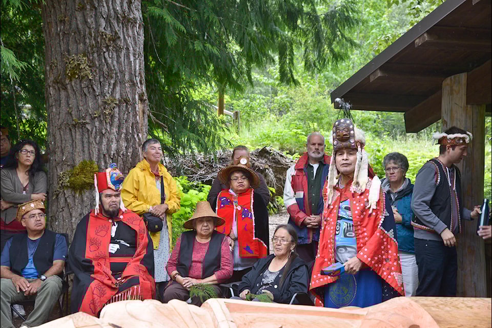 Chief Nuximlayc (Noel Pootlass) addresses a crowd during the unveiling of a totem pole on Nuxalk territory in 2018. Pootlass is among the seven leaders to sign a letter opposing Heiltsuk territorial claims.  (Michael Wigle photo)