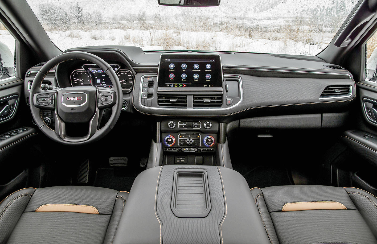 The Yukons interior-design progress from one generation to the next is dramatic. It would be more unified if GMC cut down the number of fonts it uses on the various dials, switches and displays. Check out that wide console. PHOTO: GENERAL MOTORS