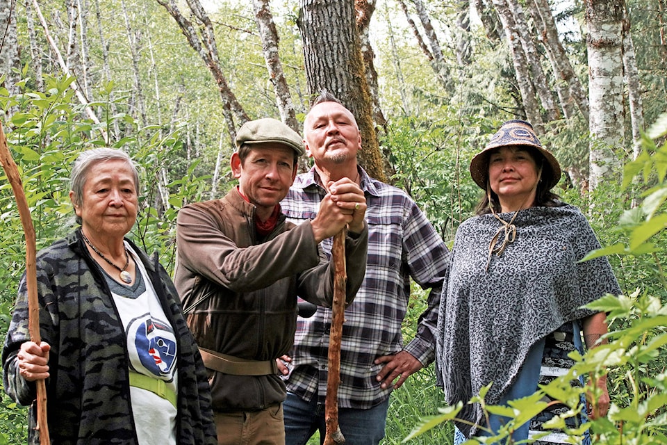 Nuxalk Nation members Son Khwona (left) and her daughter, Rhonda Sandoval, help guide Moosemeat & Marmalade co-stars Dan Hayes (from left) and Art Napoleon on Monday, May 10 while foraging in the bush during the filming of season six of the APTN show this week in the Bella Coola Valley. (Olivia Vanderwal photo)