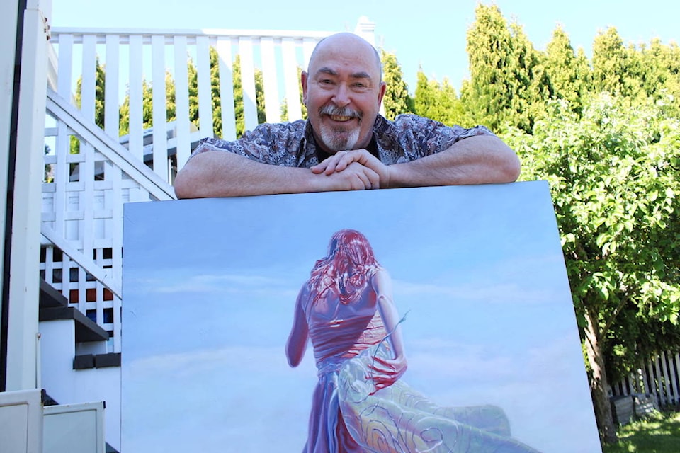 Mark Heine with a painting from his Sirens series. Two pieces from the series will go to the moon later this year. (Jake Romphf/News Staff)