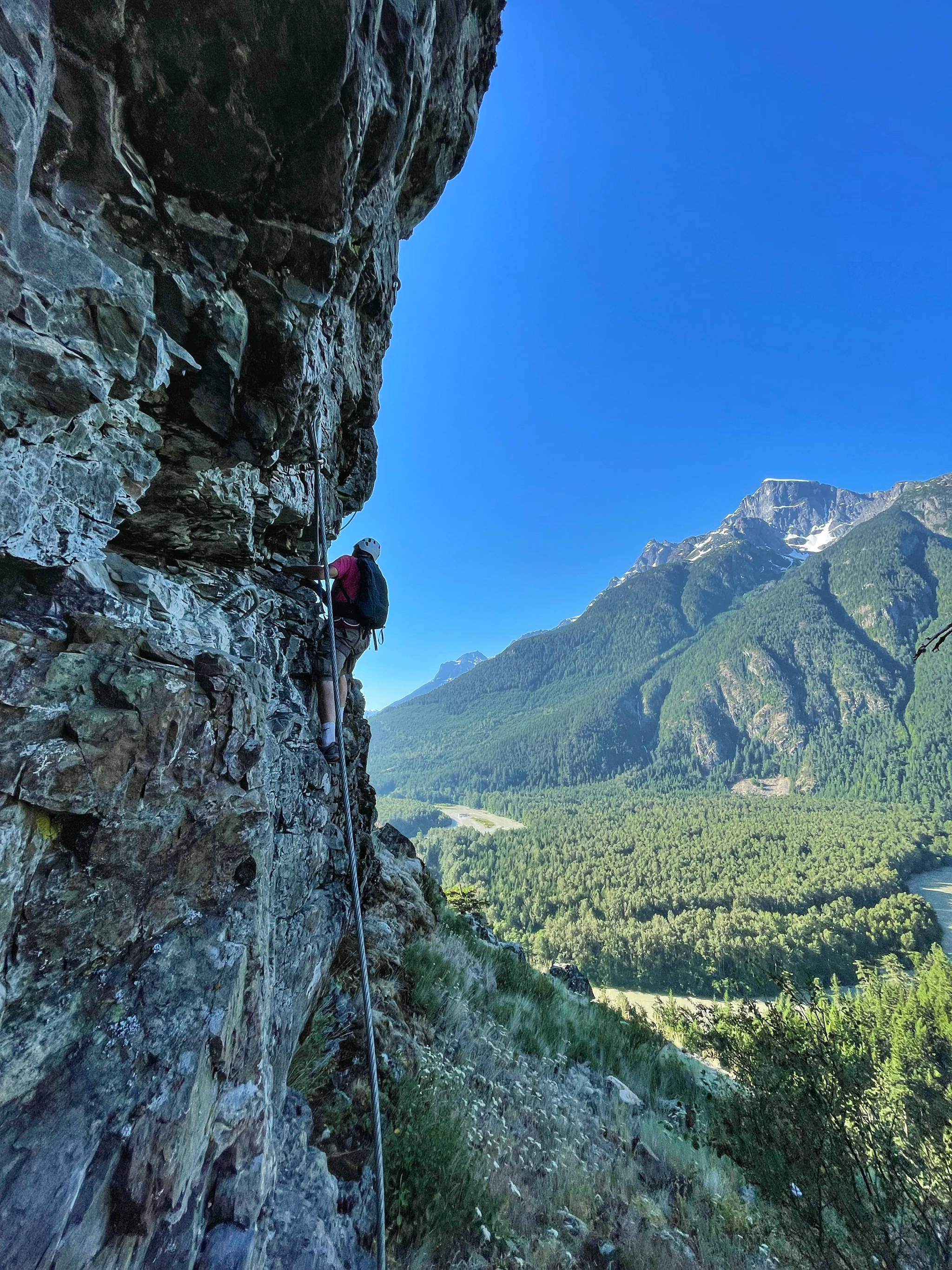 With a professional mountain guide from Tweedsmuir Park Lodge, climb Via Ferrata, a series of ladders that provide steps for footing while you are securely fixed to a cable. @PowderMatt (Matt Mosteller) photo