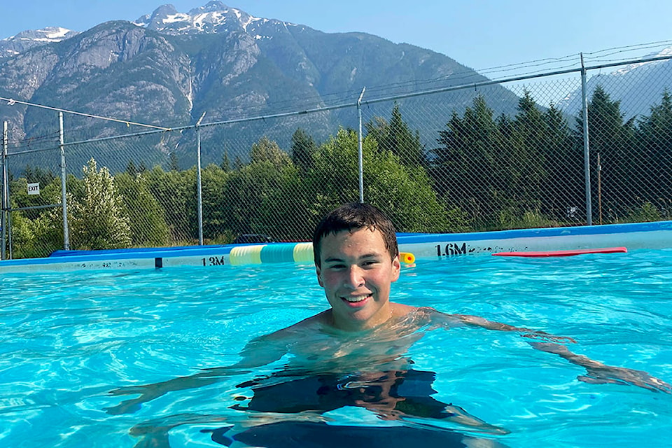 Kal Knudsen enjoys a dip in the pool, where worked his second year as a lifeguard this summer. (Angie Mindus photo)