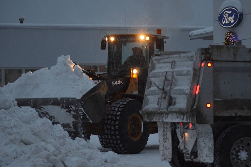 Snow was being removed in downtown Quesnel Tuesday, Dec. 28. An extreme cold warning is in effect once again. (Rebecca Dyok photo)