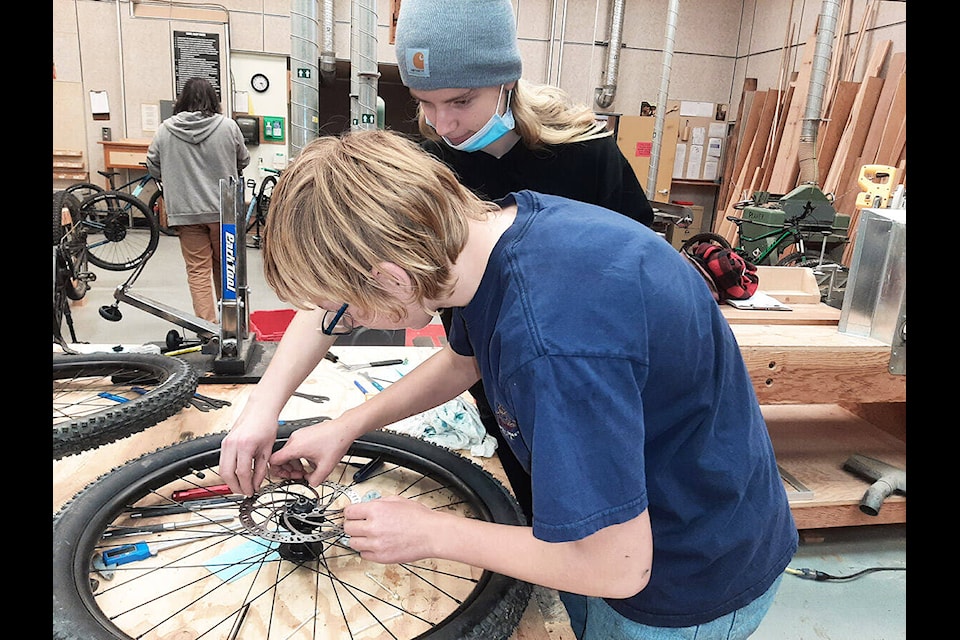 SAMS students Luke Wheatley and William Dishkin learn bike mechanics during a course offered recently at the school. (Photo submitted)
