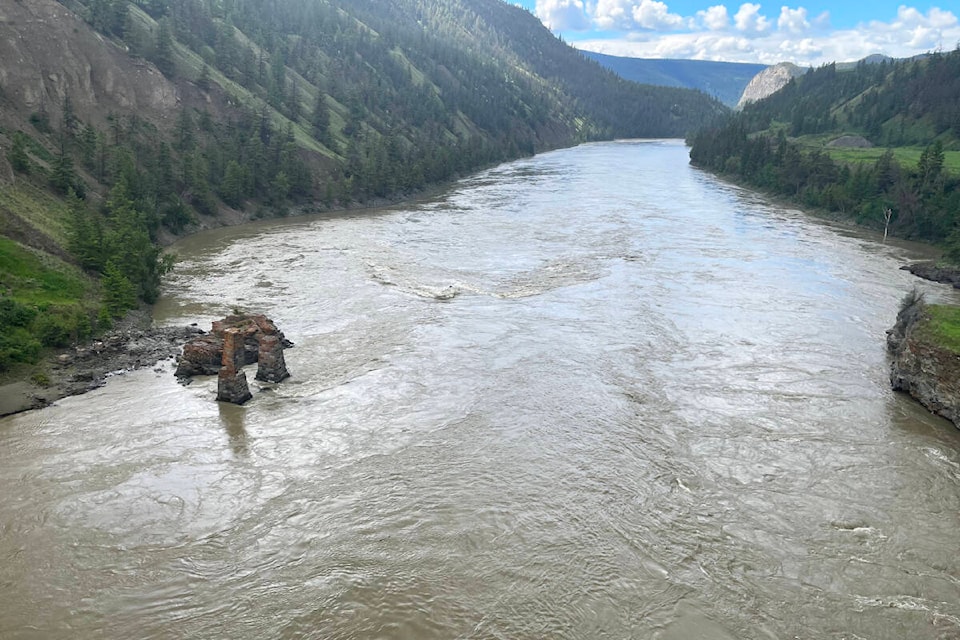 Following a night of heavy rains Sunday, June 5, the Fraser River is much higher than usual Monday morning seen here from the Sheep Creek Bridge west of Williams Lake. A rock that is usually exposed is now underwater which is very rare, said one resident. (Photo submitted - Williams Lake Tribune)
