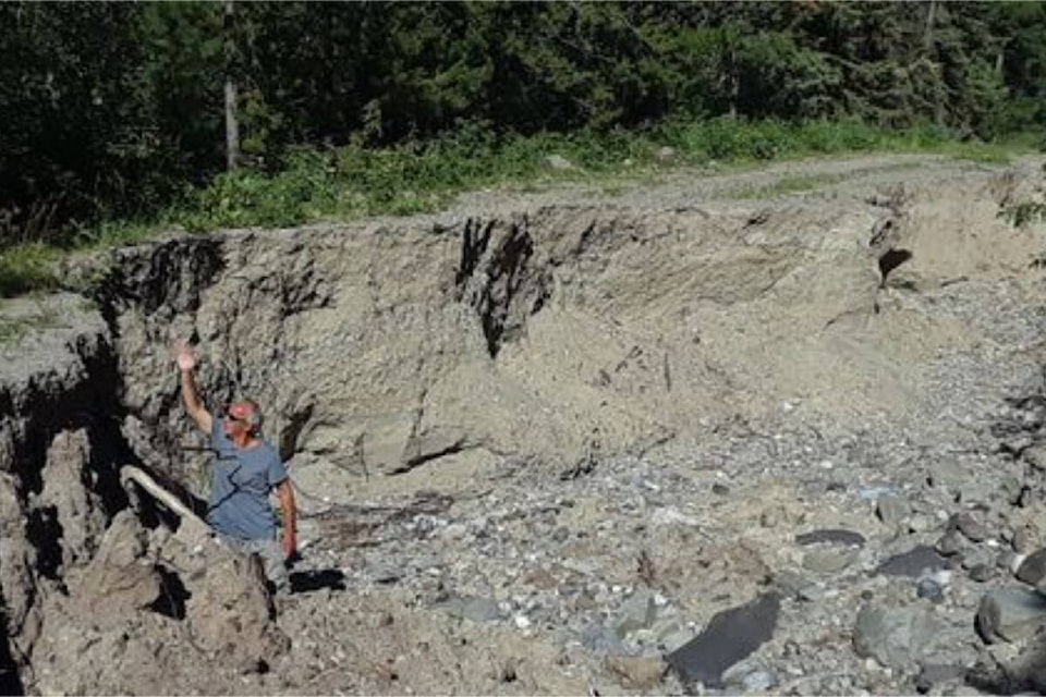 A visitor from Germany, Thomas Rother, stands inside a washout on the Miner Lake Forestry Road in the Chilcotin. (Axel Koehn photo)