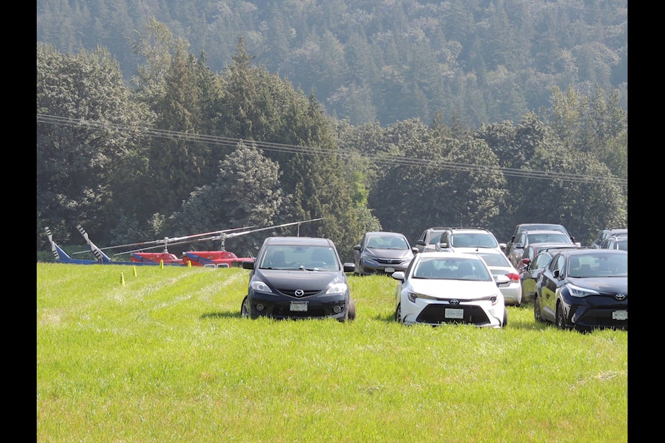 Film crew cars and helicopters were parked across from Harrison Resort Golf Course as part of the filming of “Hourglass” in the Harrison Lake area. (Adam Louis/Observer)