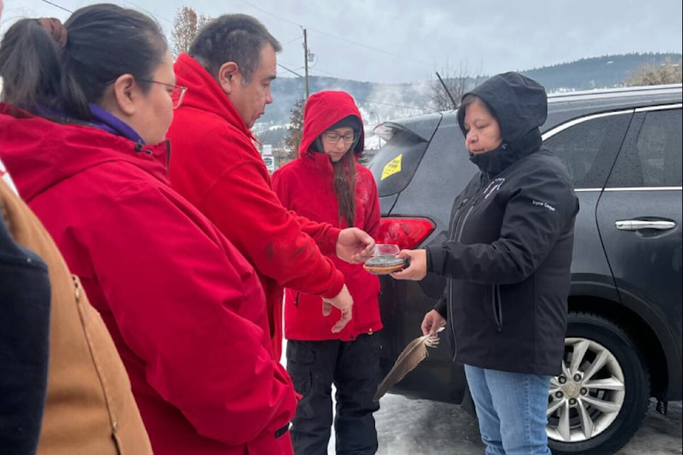 Joyce Charleyboy, right, smudges Carl Schooner Sr. and his wife Charlene Schooner at the Williams Lake Stampede Grounds on Tuesday, Dec. 27. (Loretta Williams photo)